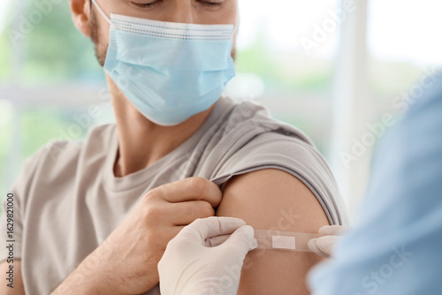 Young man with doctor apply...