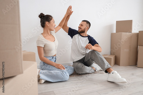 Young couple with key from ...