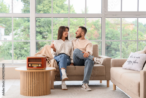 Young couple listening to r...