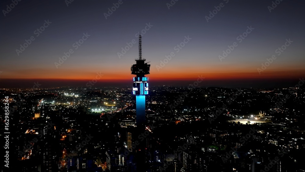 Obraz premium Sunset Telkom Antenna In Johannesburg Gauteng South Africa. Highrise Building Dominating The Skyline Of The Downtown. Building Landscape Skyscrapers Stunning. Industry Urban Corporate.