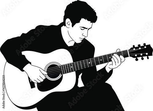 Young man playing an acoustic guitar with intense focus