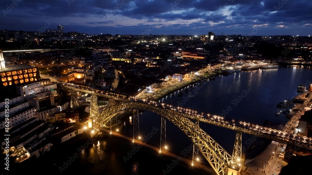 Fototapeta premium Night Dom Luis I Bridge In Porto Portugal. Scenic Railway Station And Skyscrapers From Above. Building Town Sky Background Illuminated Urban. Illuminated City Landmark. Porto Portugal.