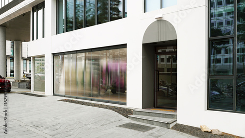 Contemporary Building Entrance with Clean White Facade and Glass Doors