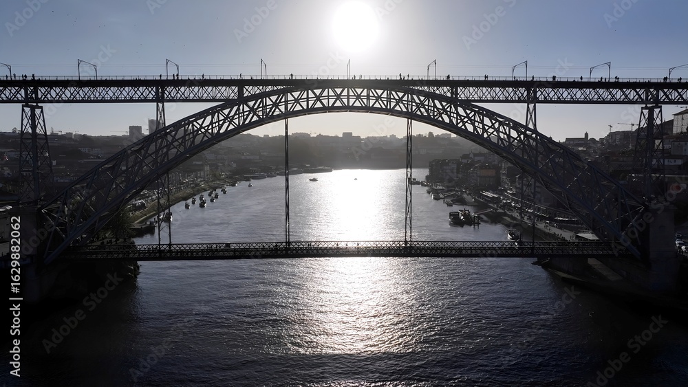 Naklejka premium Luis I Bridge In Porto Portugal. Iconic Structure Of Bridge Connecting Landmarks Streets. Metropolitan Landscape Commercial Building Amazing. Commercial Building. Porto Portugal.