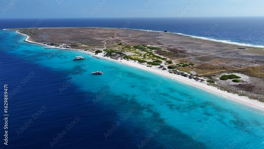 Fototapeta premium Klein Curacao Beach In Willemstad Netherlands Curacao. Bird Eye View Of A Amazing Coastal Beach In The Summer Holiday. Shore Sky Clouds Beach Sea. Seaside Panorama. Willemstad Netherlands.