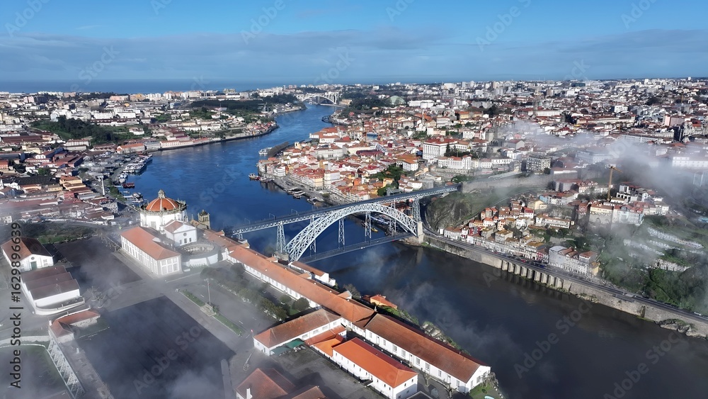 Obraz premium Luis I Bridge In Porto Portugal. City Skyline Showing Modern And Traditional Architecture. Business Sky Downtown Cityscape. Business Panning Wide. Porto Portugal.