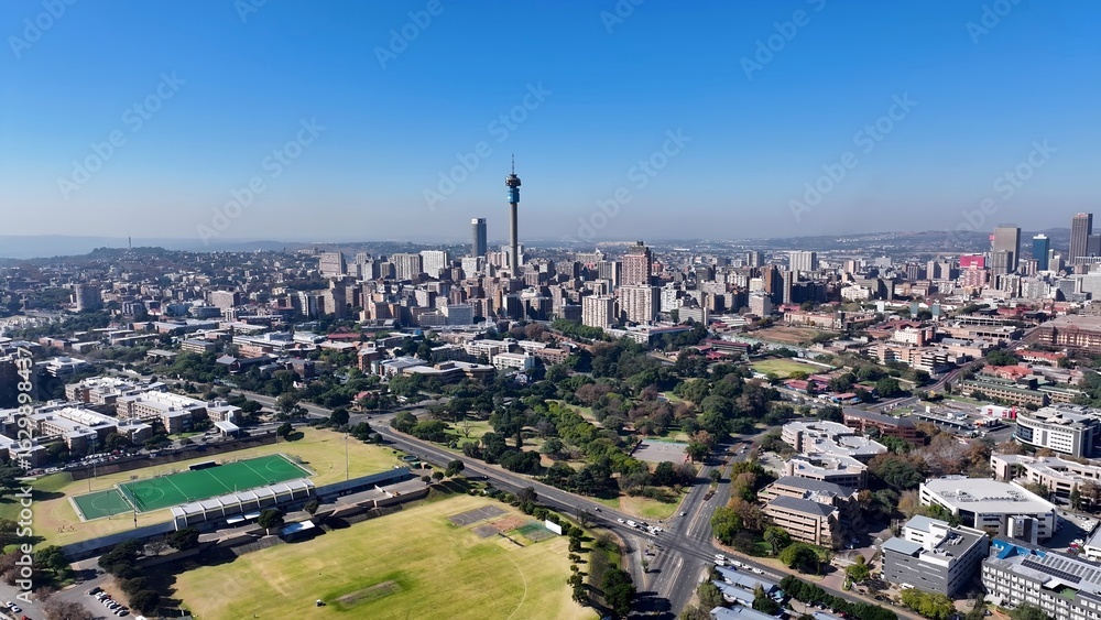 Obraz premium Johannesburg Skyline In Johannesburg Gauteng South Africa. Aerial View Of A Bustling City With High-Rise Buildings And Traffic. Business Sky Background Downtown Cityscape.