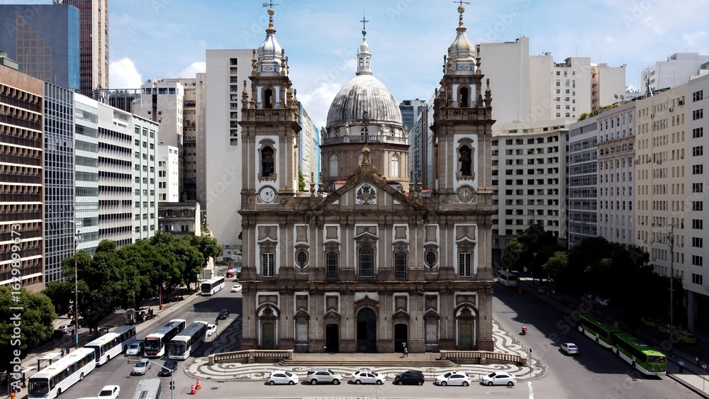 Naklejka premium Candelaria Church In Rio De Janeiro Brazil. Bird Eye View Of Church Standing Tall Amidst Beautiful Scenery. Town Sky Clouds Backgrounds Urban. Town Panorama. Rio de Janeiro Brazil.