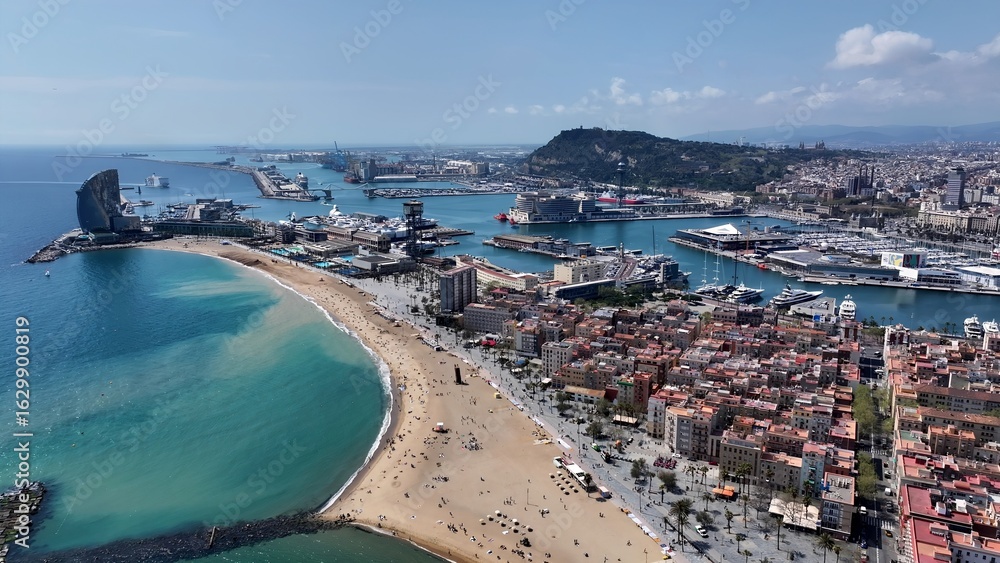 Fototapeta premium Barcelona Skyline In Barcelona Catalonia Spain. Aerial View Of Stunning Beach With Crystal Clear Waters. Shore Clouds Sky Beach Sea. Shore Beach Scenic Coastline. Barcelona Catalonia.