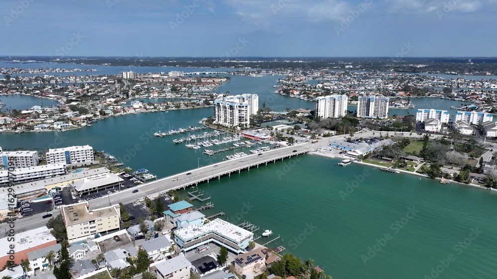 Fototapeta premium St. Pete Beach In Saint Petersburg Florida United States. Aerial View Of A Bustling City With High-Rise Buildings And Traffic. Coast Horizon Seaside Summertime. Coast Panoramic.