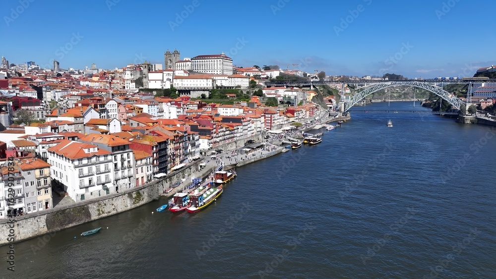 Ribeira Pier In Porto Portugal. Aerial View Of Stunning Beach With Crystal Clear Waters. Town Sky Clouds Backgrounds Urban. Town Outdoor Downtown Panning Wide. Porto Portugal. Ribeira Pier In Porto Portugal. Aerial View Of Stunning Beach With Crystal Clear Waters. Town Sky Clouds Backgrounds Urban. Town Outdoor Downtown Panning Wide. Porto Portugal.