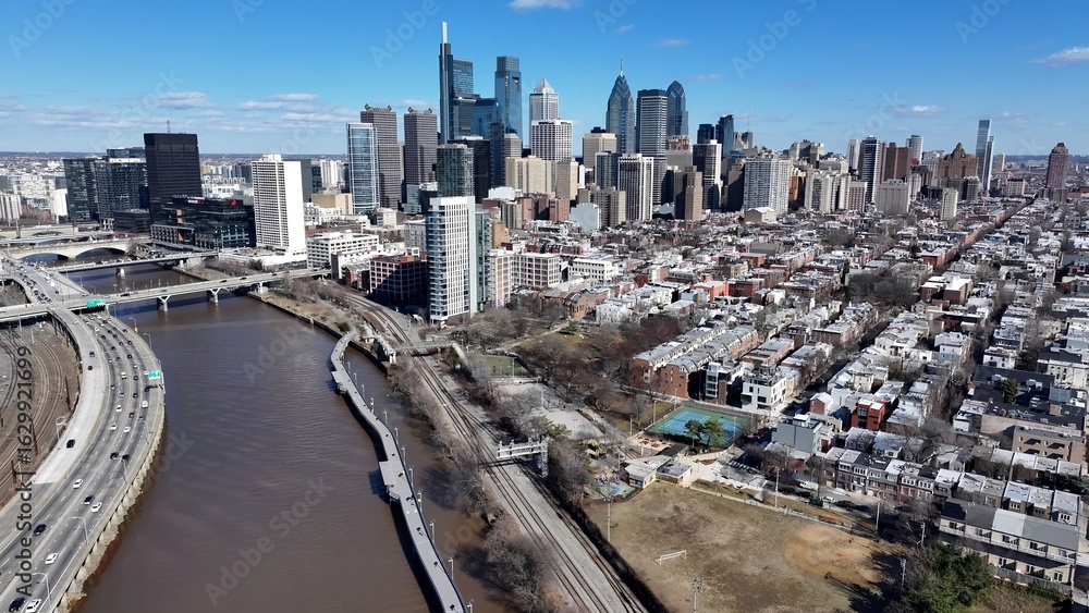 Obraz premium Schuylkill Riverwalk In Philadelphia Pennsylvania United States. Aerial View Of A High-Rise Buildings And Traffic Showcasing Urban Life. Town Sky Backgrounds Urban. Outside Backgrounds Up Above.