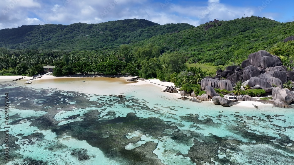 Fototapeta premium Anse Source D Argent Beach In La Digue Island Victoria Seychelles. Bird Eye View Of A Amazing Coastal Beach In The Summer Holiday. Coast Horizon Seaside Summertime. Coast Panoramic.