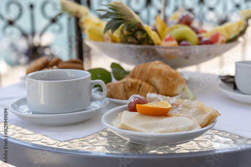 breakfast with coffee and croissant