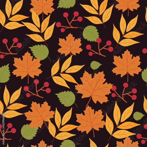 Autumn seamless pattern with different yellow, green and orang leaves on the dark background. Fall concept. 