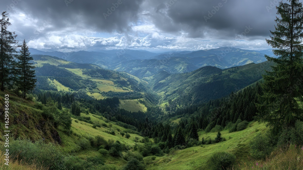 Obraz premium A panoramic view of rolling green hills under a cloudy, dramatic sky