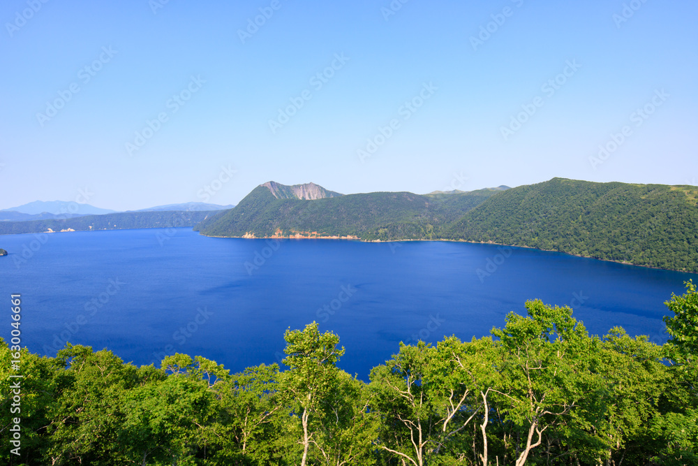 Fototapeta premium Lake Mashu, Panoramic View of Serene Blue Lake in Hokkaido's Caldera