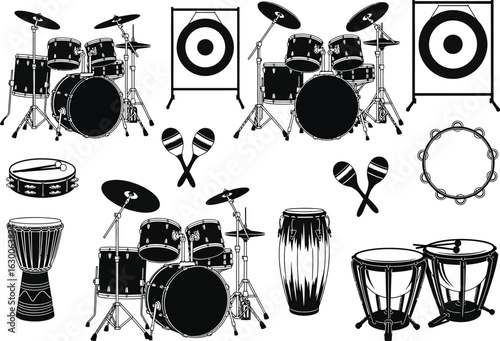 Collection of various percussion instruments and speakers arranged for a musical performance or recording session