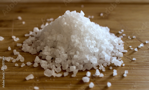 Pile of coarse salt on a wooden cutting board