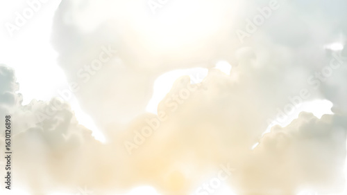 Golden sunrise paints sky with soft clouds and dramatic silhouette shapes