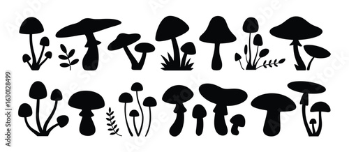 Black mushroom silhouettes with leaves fungi white.eps