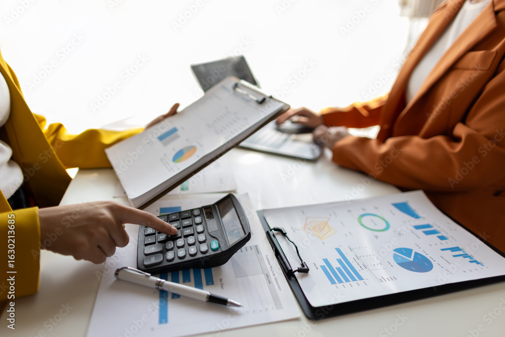 Businesswoman meeting with consultant discussing financial situation analysis in business and marketing report. Financial planning, accounting and business strategy. Businesswoman meeting with consultant discussing financial situation analysis in business and marketing report. Financial planning, accounting and business strategy.