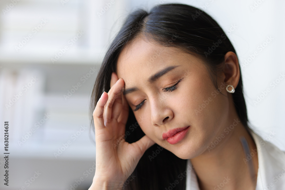Close-up: Asian woman is sick and stressed. Close-up: Asian woman is sick and stressed.