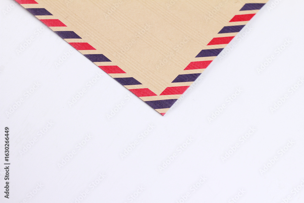 Obraz premium Close up of an antique envelope on a white background.