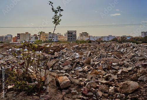 Heaps of rubble and garbage polluting suburban settlement in north africa