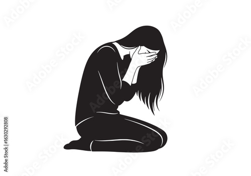 A distraught woman with long hair kneels on the ground, crying into her hands in despair.
