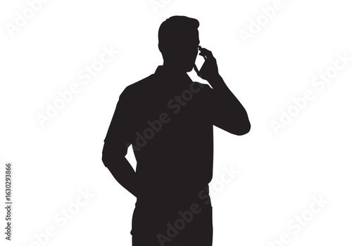 A black silhouette of a man standing while talking on a mobile phone against a white background.