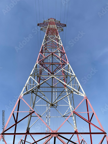 Electric power lines closeup against blue sky