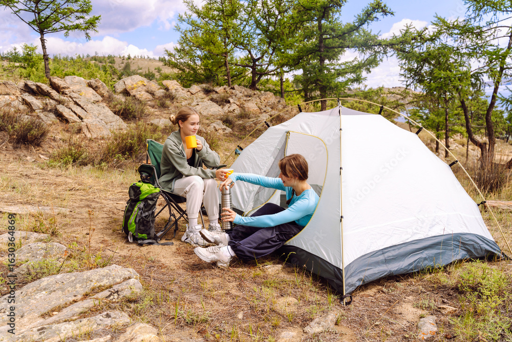 Fototapeta premium Camping adventures with friends in nature enjoying skills of outdoor living