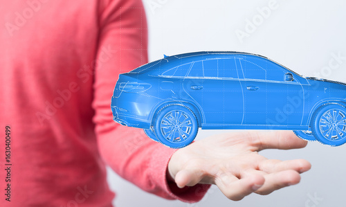 A hand holds a digital rend...