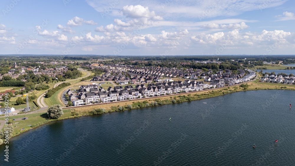 Fototapeta premium Aerial suburban view by a lake