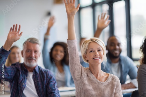 Diverse Group of Adults Engaged in Classroom Setting Raising Hands.