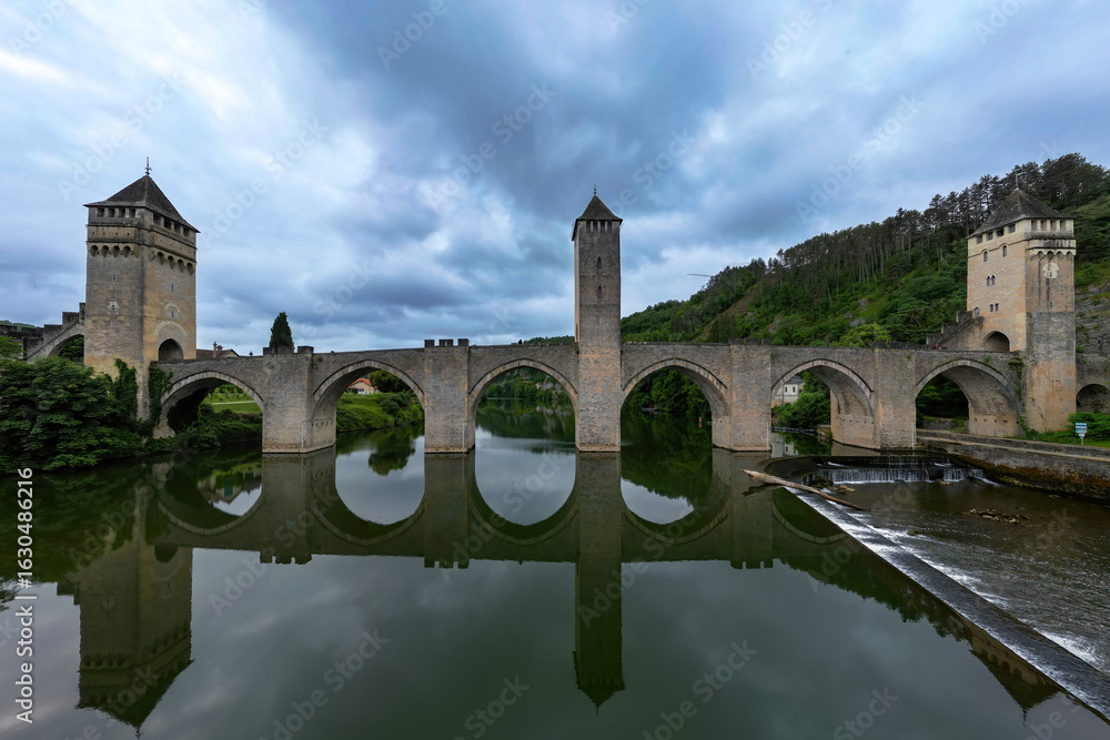 Fototapeta premium Pont Valentré, a 14th-century six-span fortified stone arch bridge crossing the river Lot in France