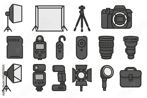 Photography equipment arranged on a flat surface including cameras, lights, and lenses for a professional shoot