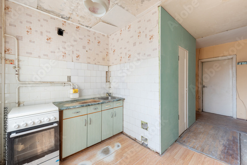 Kitchen in bad condition in an abandoned building. Abandoned house interior. Old Soviet Russian Poor Interior.