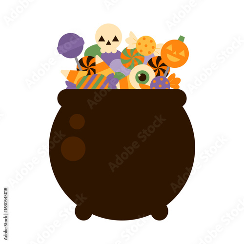 Halloween cauldron full of candy. Halloween candy pot. Autumn treats for Halloween for children. Lollipops in cauldron