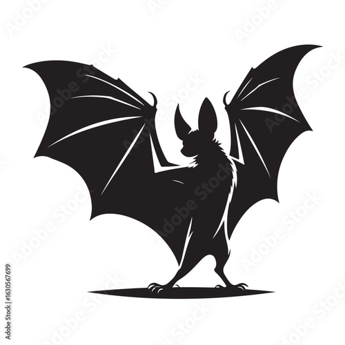 Striking black silhouette of a bat in flight perfect for halloween or nocturnal themes