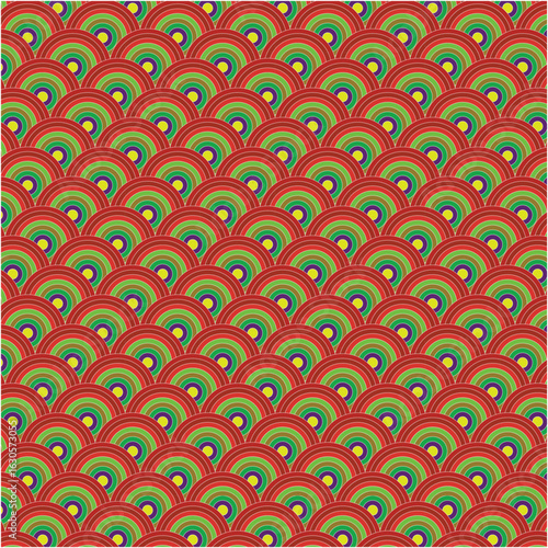 Abstract pattern of green fanned shapes on red background