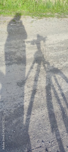 Wallpaper Mural Shadow of person with bicycle on rural dirt road in sunlight Torontodigital.ca
