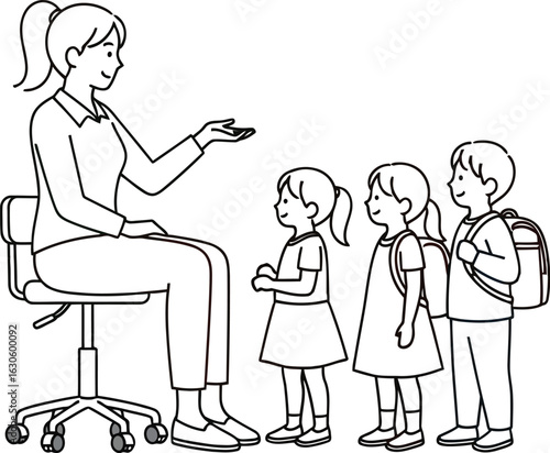 Teacher sitting with children in a classroom waiting in a single line