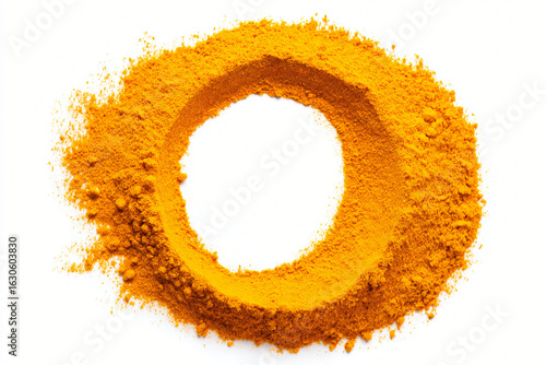 Fototapeta Naklejka Na Ścianę i Meble -  Vibrant turmeric powder ring, spice circle for culinary presentation.