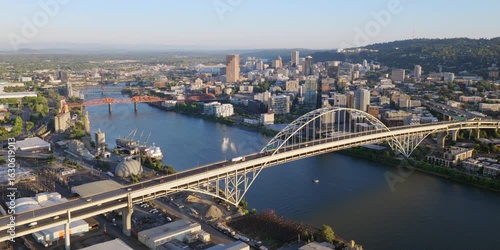 Portland Oregon - Aerial Approach over Bridges and River at Sunset Towards Downtown Portland Skyline and City
