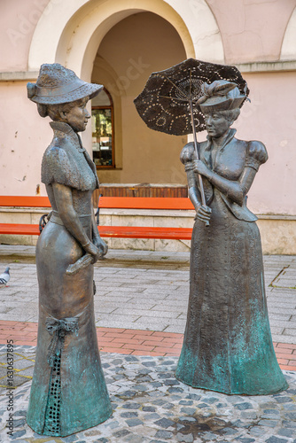 Bronze statue of two elegant victorian ladies conversing. Nagykanizsa, Hungary.