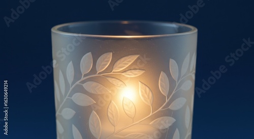 Candle in frosted glass holder