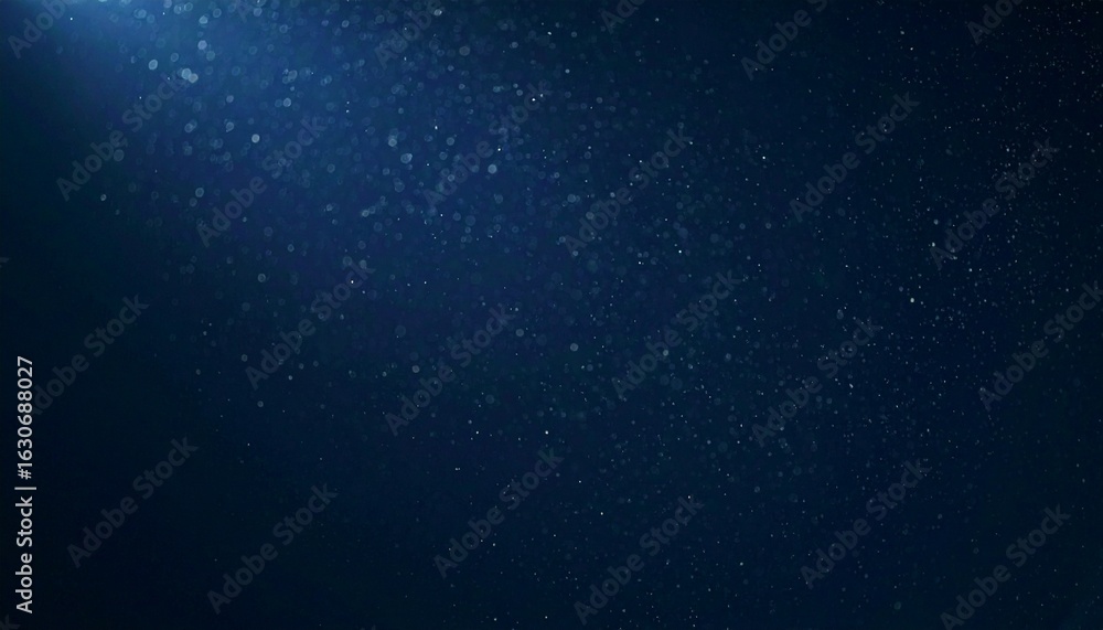 Fototapeta premium Floating dust particles illuminated by a single cinematic beam of light on a dark gradient background