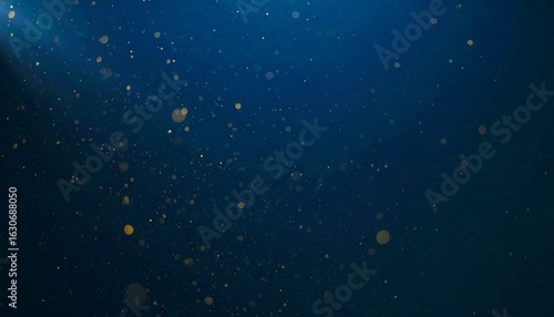 Floating dust particles illuminated by a single cinematic beam of light on a dark gradient background